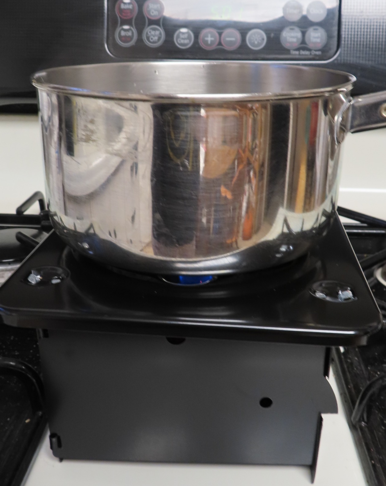 Coghlan's Portable Folding Camp Stove – Compact, Lightweight Steel Cooking Stove for Camping, Backpacking, Hiking, or Emergency Use – Uses Canned Heat or Fuel Tablets, Black customer photo 2