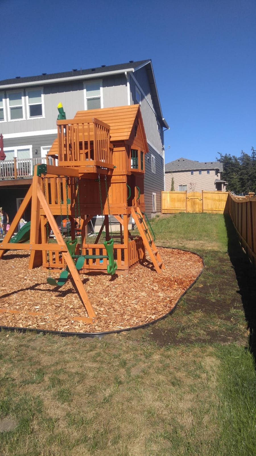 Backyard Discovery Skyfort II Cedar Wood Swing Set with Wave Slide, Raised Clubhouse, Crow's Nest, Monkey Bars, Balcony, Belt Swings, Trapeze, Rock Wall, Picnic Table, Sandbox, Ladder, Outdoor Playset customer photo 2