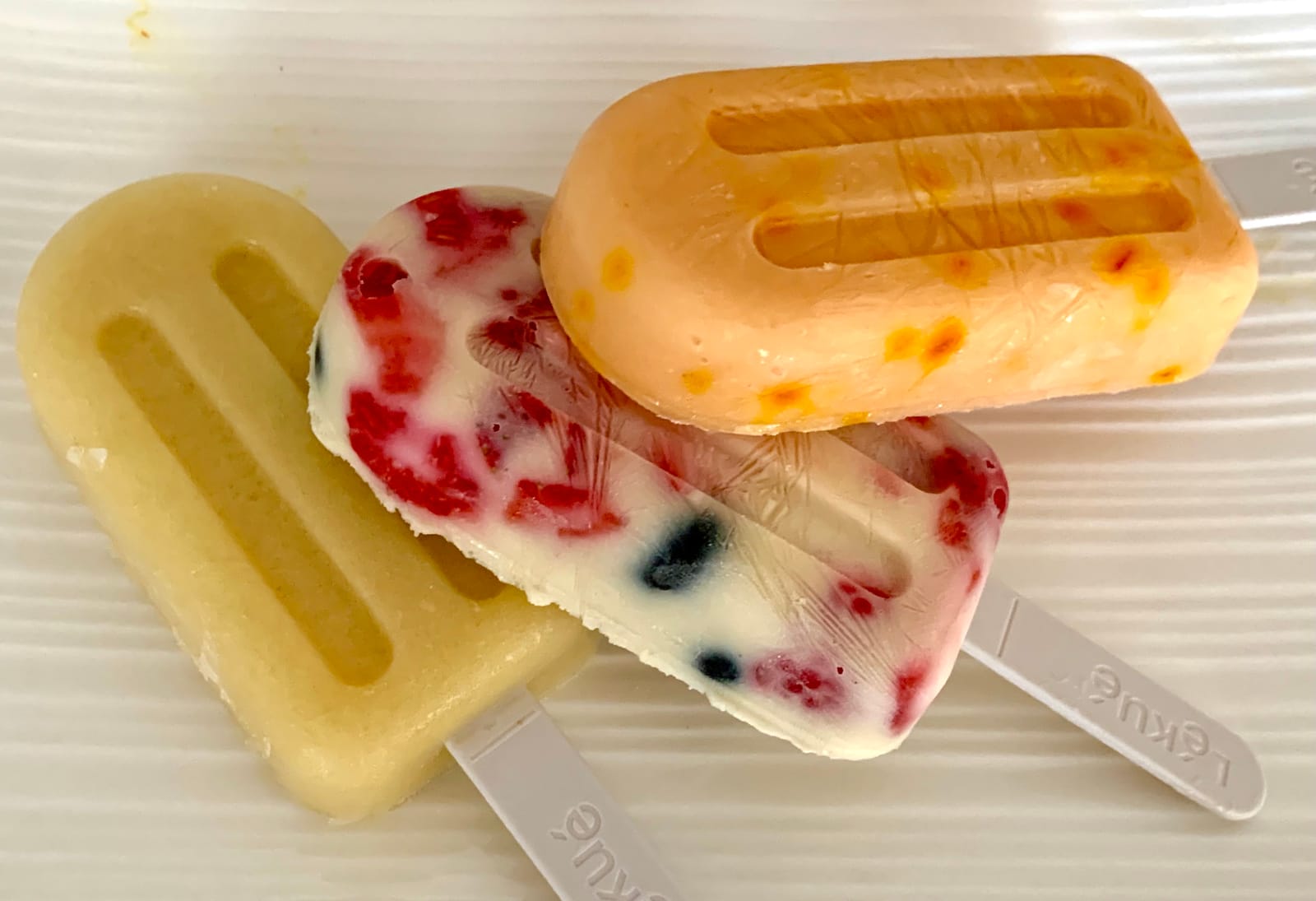 Lékué Set of 4 Stackable Popsicle Molds + Sticks & Lids | Homemade Freezer Ice Pops & Frozen Snacks | Flexible Platinum Silicone for Easy Fill & Unmold | Reusable & Dishwasher Safe| Multicolor customer photo 1