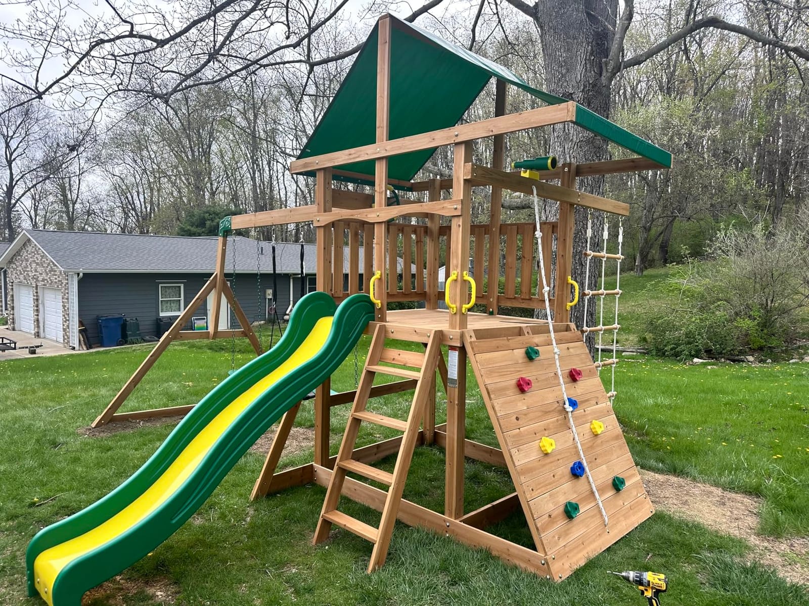 Backyard Discovery Mount Mckinley Cedar Wood Swing Set with Wave Slide, Play Deck, Double Rock Wall, Rope Ladder, Web Swing, Belt Swings, Toy Telescope, Steering Wheel, Sandbox Area, Outdoor Playset customer photo 1