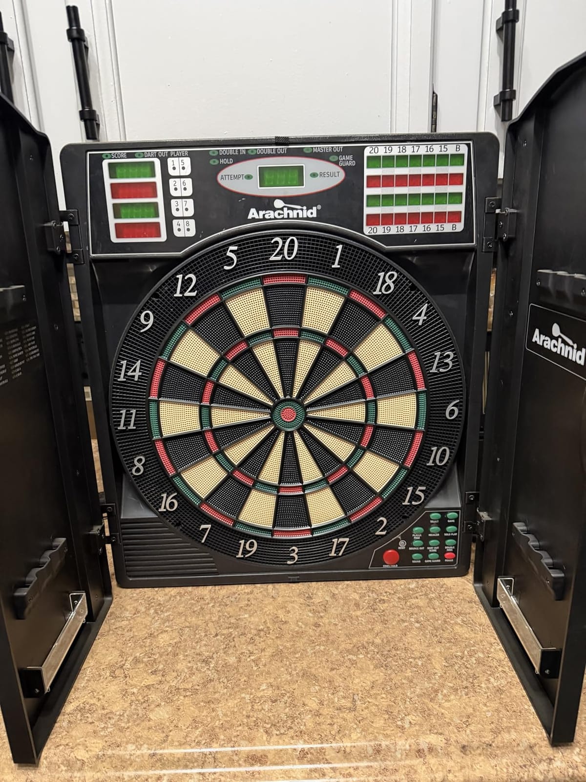 Arachnid Titanium 5400: 13.5” Target with Integrated Cabinet. Offers 38 Games, 316 Variations, Color LED Scoring, and Solo Play. Includes Double in/Out Modes for Competitive Game Room Fun. customer photo 1