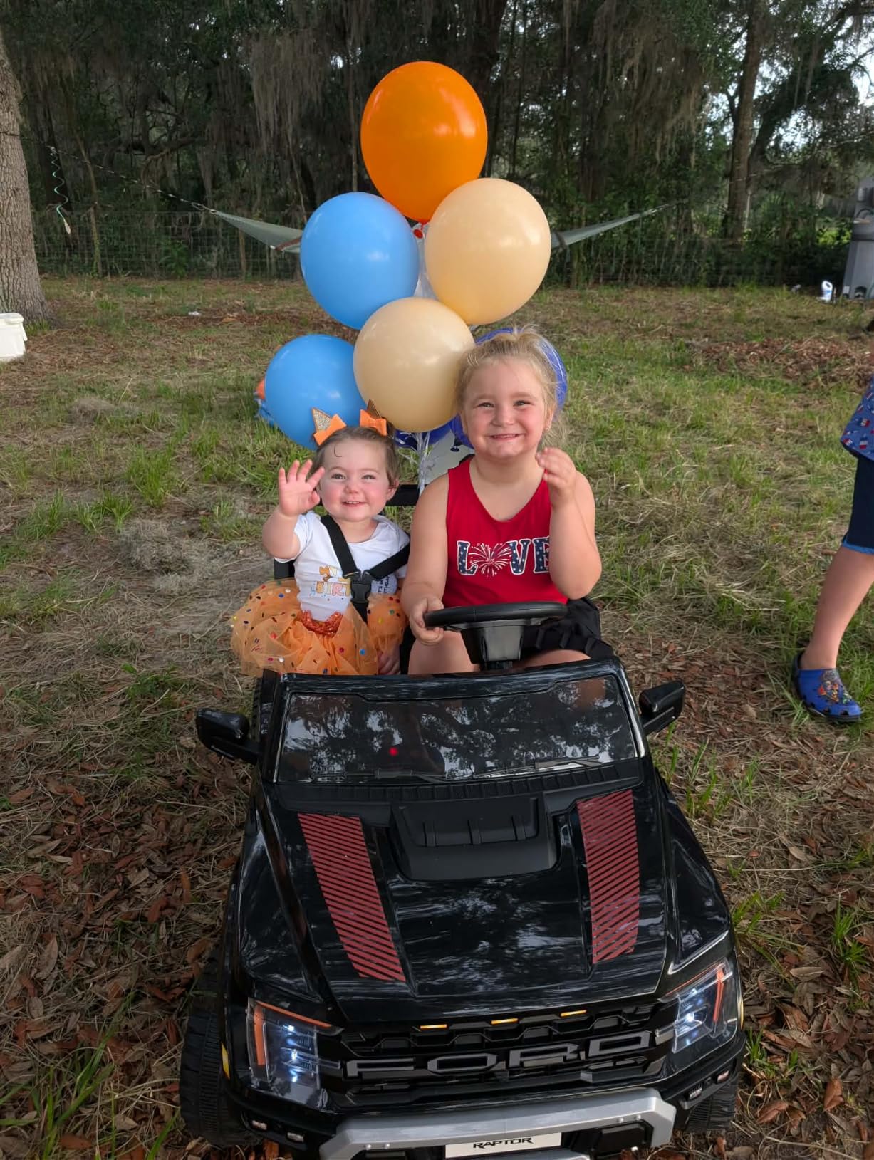 First Ride On 24V Kids Ride On Truck, Licensed Ford F-150 Raptor 2 Seater Electric Car w/Remote Control, Kids Ride On Car Toys w/LED Lights, Bluetooth, Music, Truck Bed Storage, Soft Start (White) customer photo 1