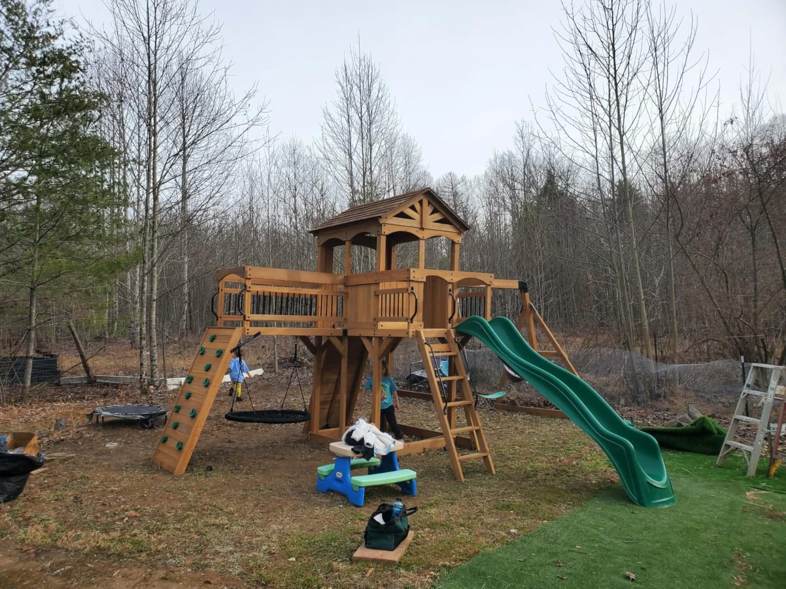 Backyard Discovery Dover Bay Spruce Wood Swing Set with Spiral Tube Slide, Wave Slide, Clubhouse, Rock Wall, Belt Swings, Step Ladder, Toy Telescope, Chalkboard, Outdoor Playset customer photo 1