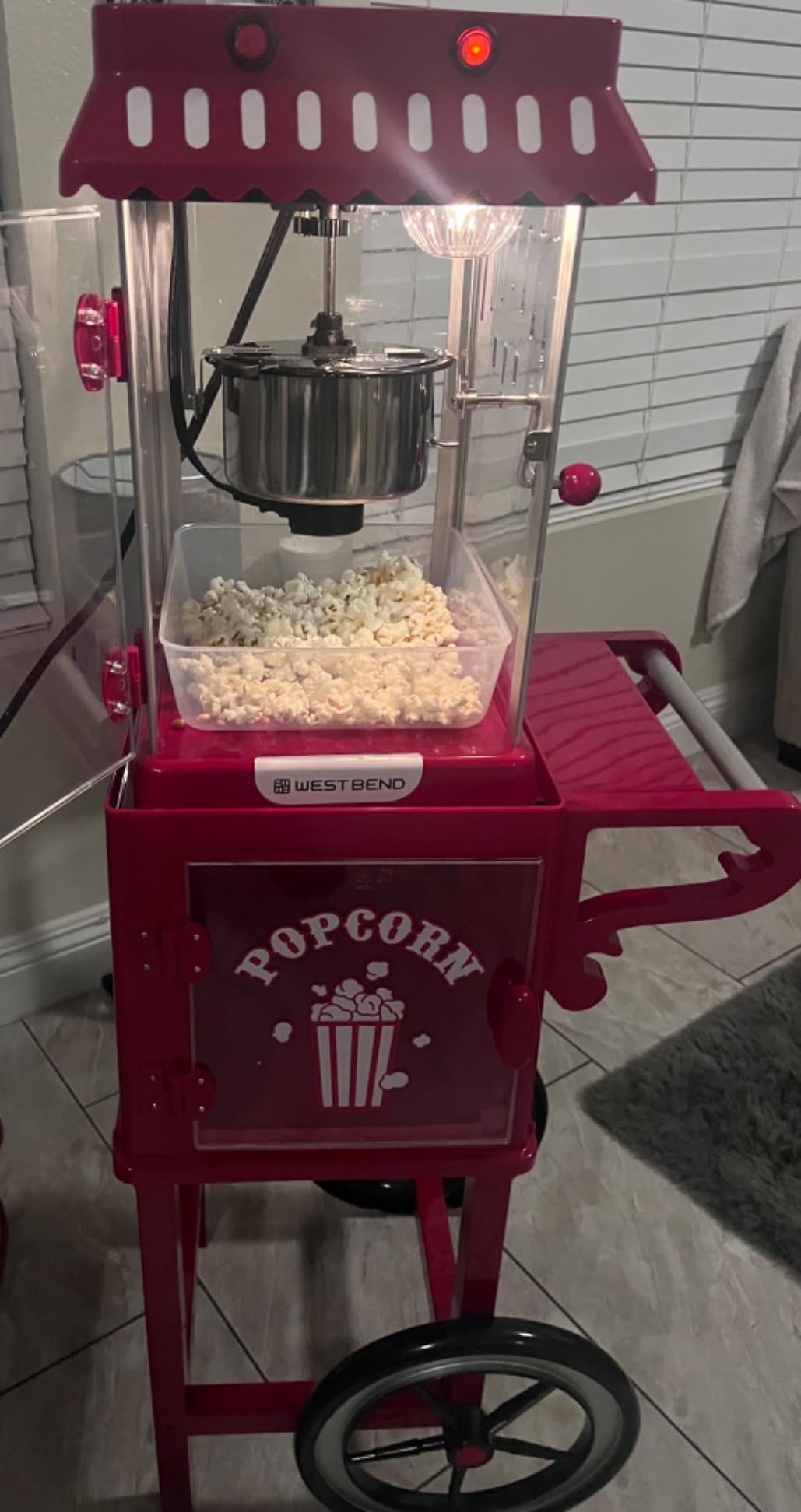 West Bend Popcorn Cart Vintage Theater Style with 2.5 oz Stainless Steel Kettle, Removable Serving Tray, Built-In Storage, Portable Design, 10 Cup Capacity, in Red/Silver customer photo 2